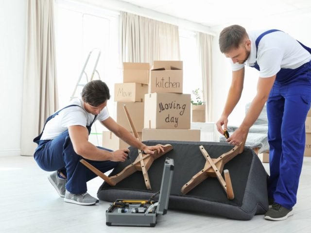 Movers-disassembling-the-furniture